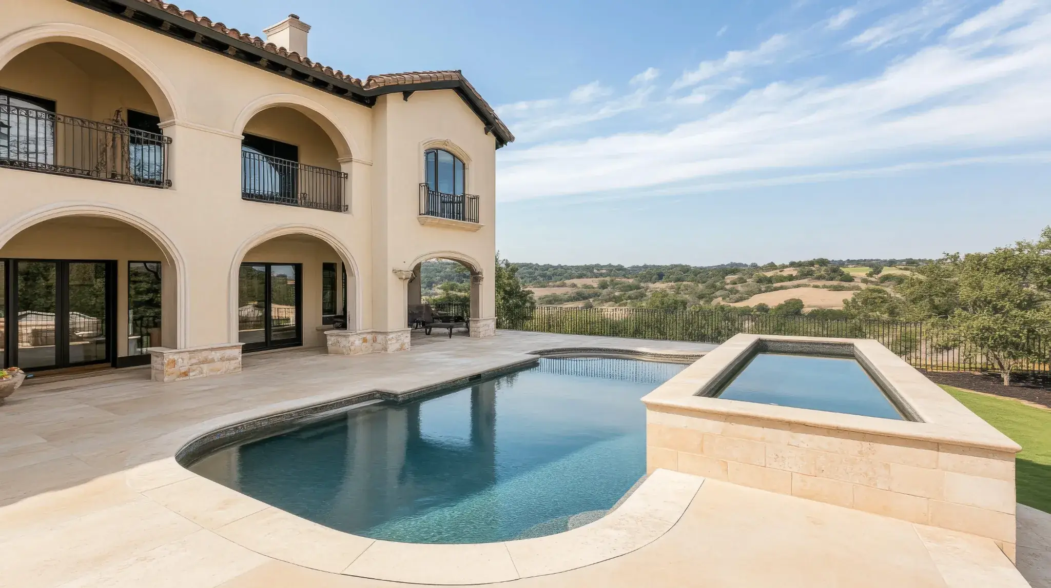 Hillside home with a pool and a view of the hills